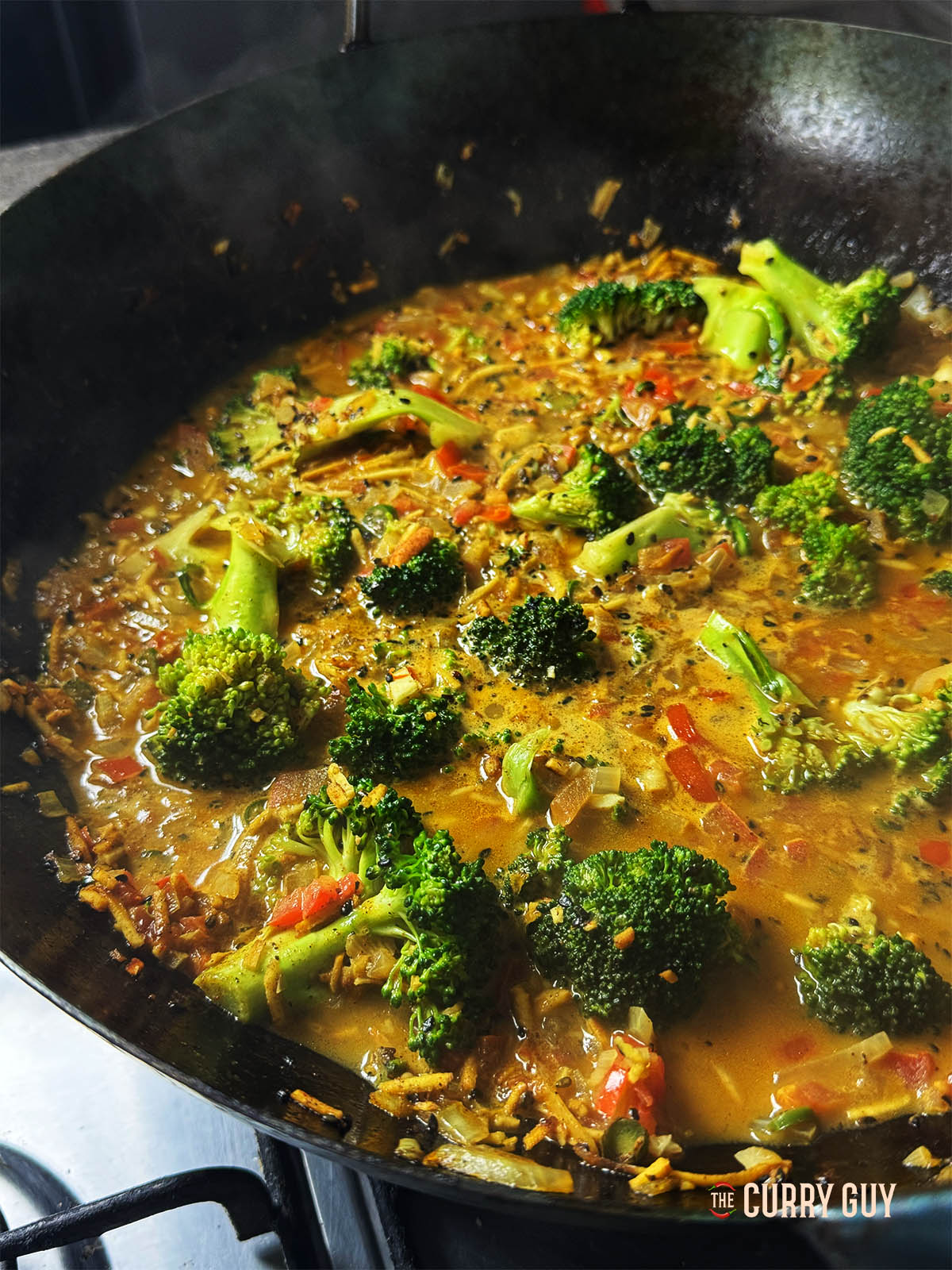 Broccoli curry in a wok.