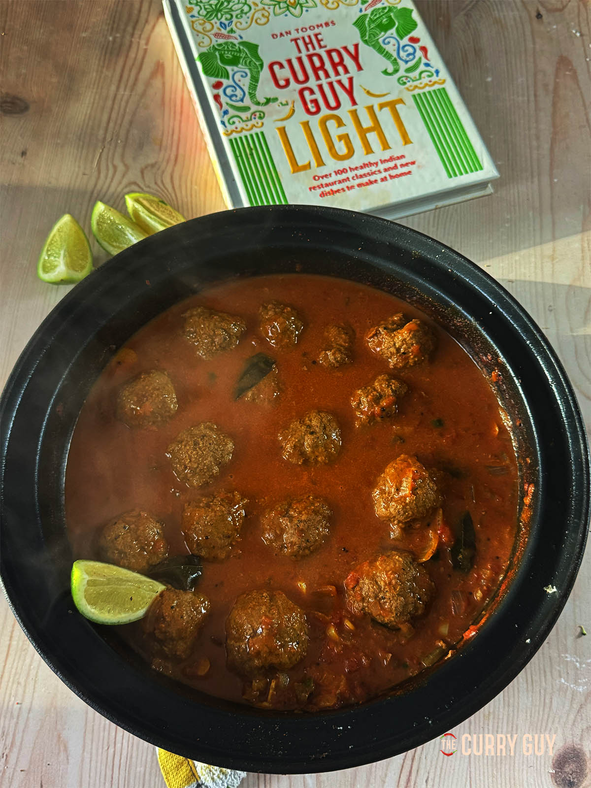 The Goan Beef Kofta Curry next to The Curry Guy Light cookbook.