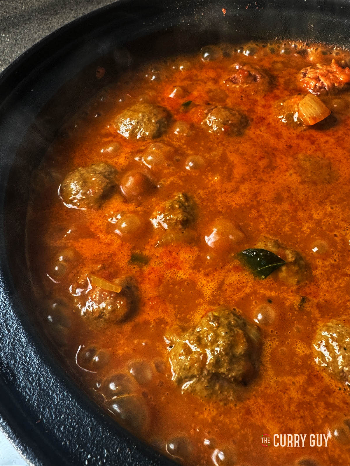 The curry after the kofta have cooked for 10 minutes. 