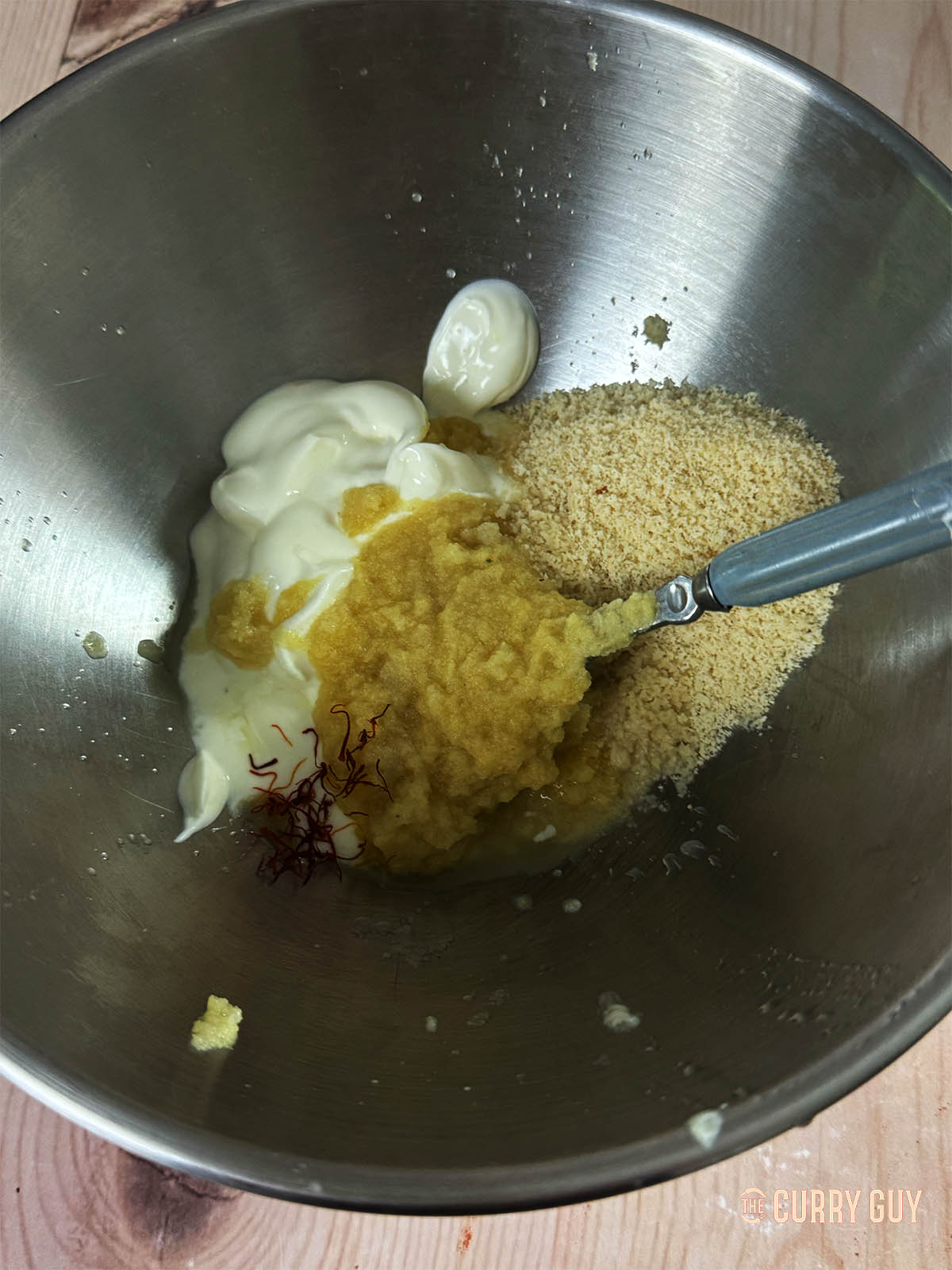 The yoghurt marinade ingredients in a mixing bowl.