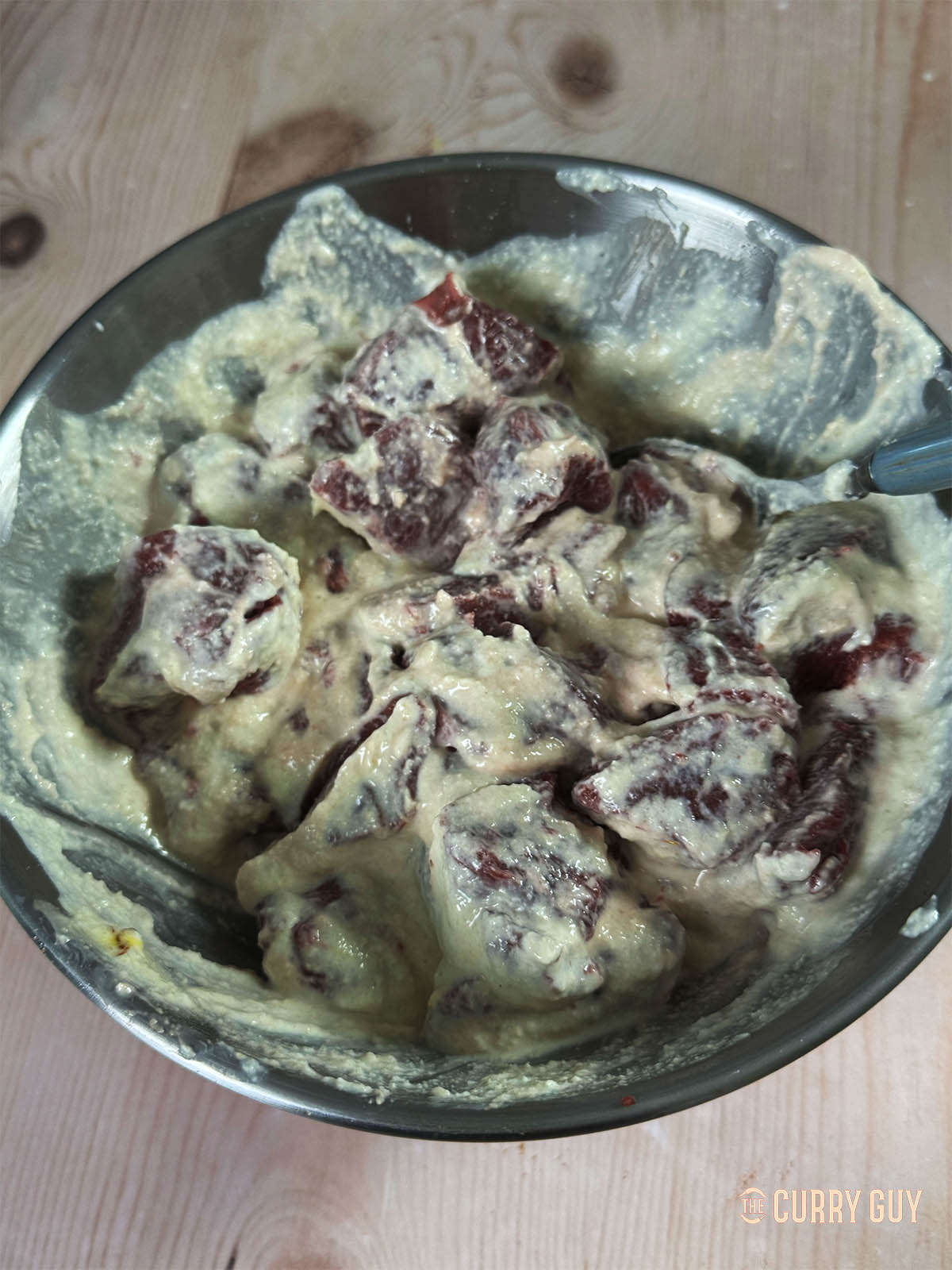 The venison meat in the marinade.