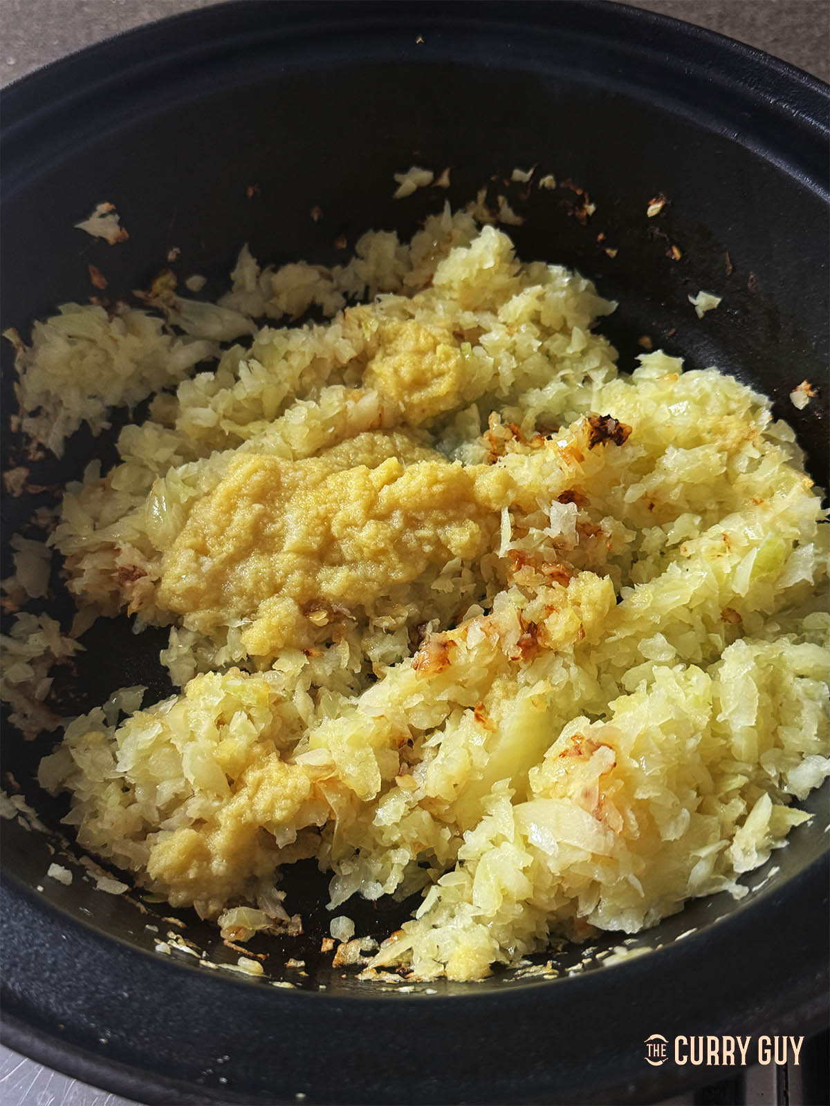 Frying the onions until lightly browned in a pan.