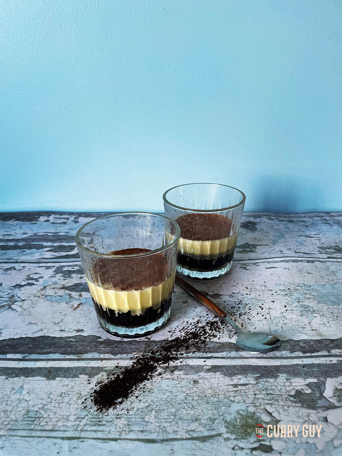Vietnamese Egg Coffee poured into two glasses so that you can see the layers.
