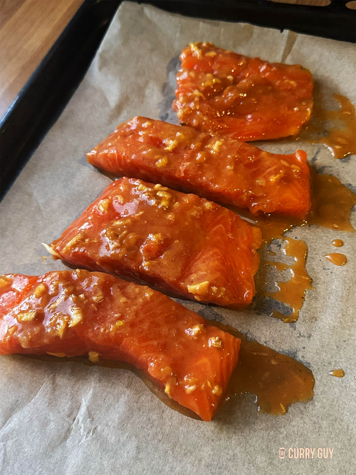 The salmon on a baking sheet, ready for the oven.