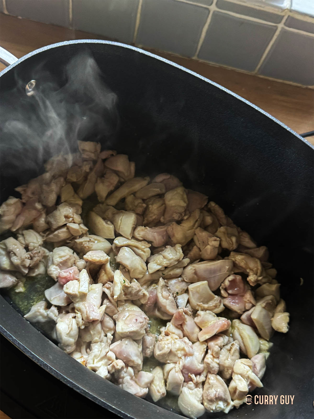 Searing the chicken in the slow cooker using sauté function.