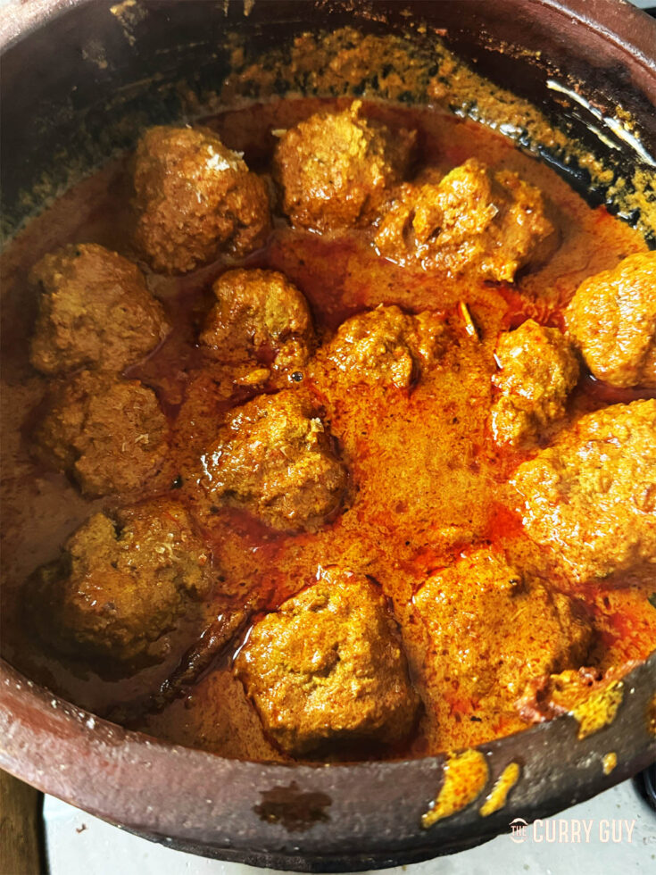 Kashmiri rista simmering in a pot.