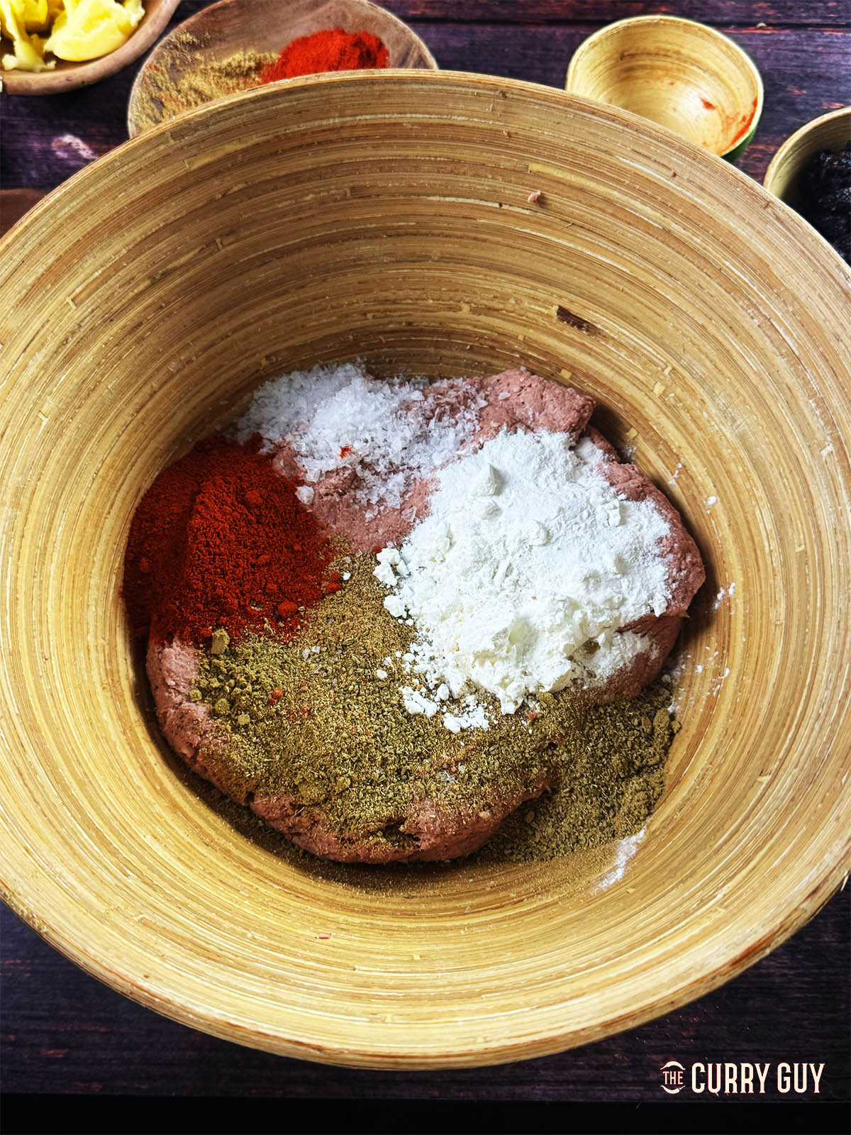 All of the meatball ingredients in a mixing bowl.