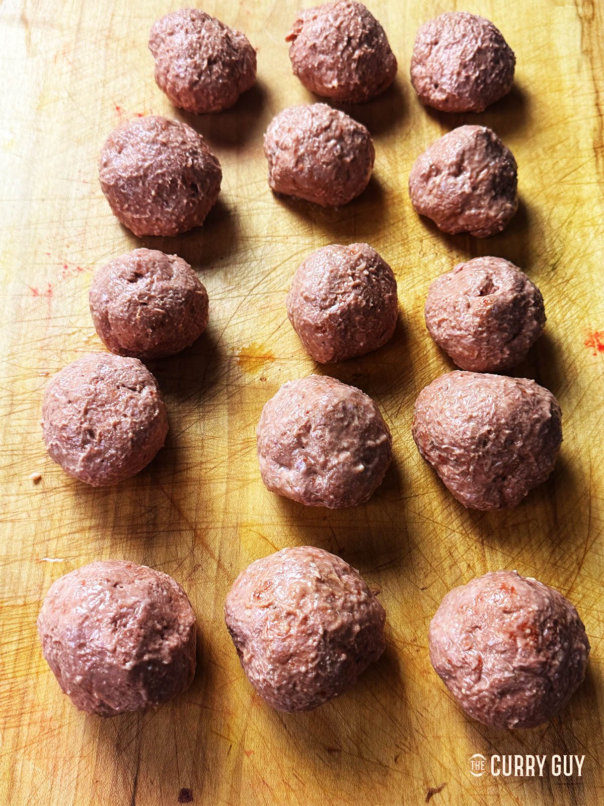 Formed meatballs  (Rista) on a counter top. 