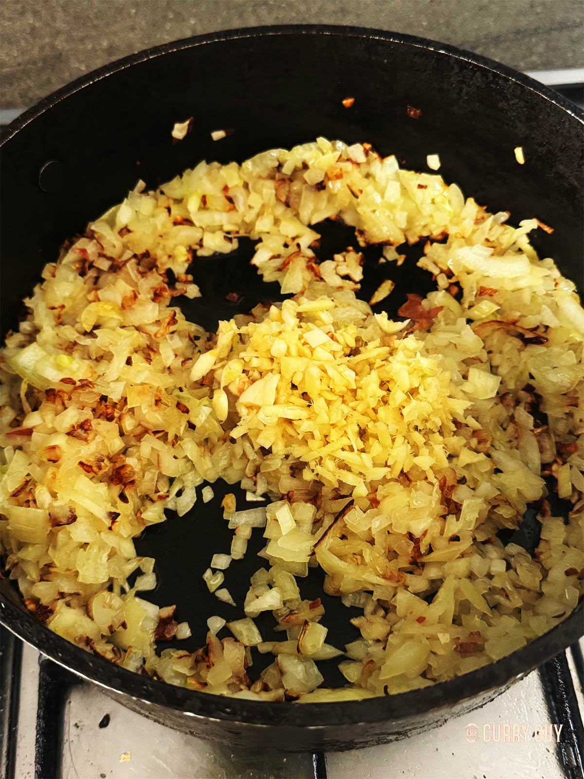 Stirring in the garlic and ginger.