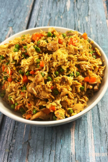 Chicken fried rice in a serving bowl.