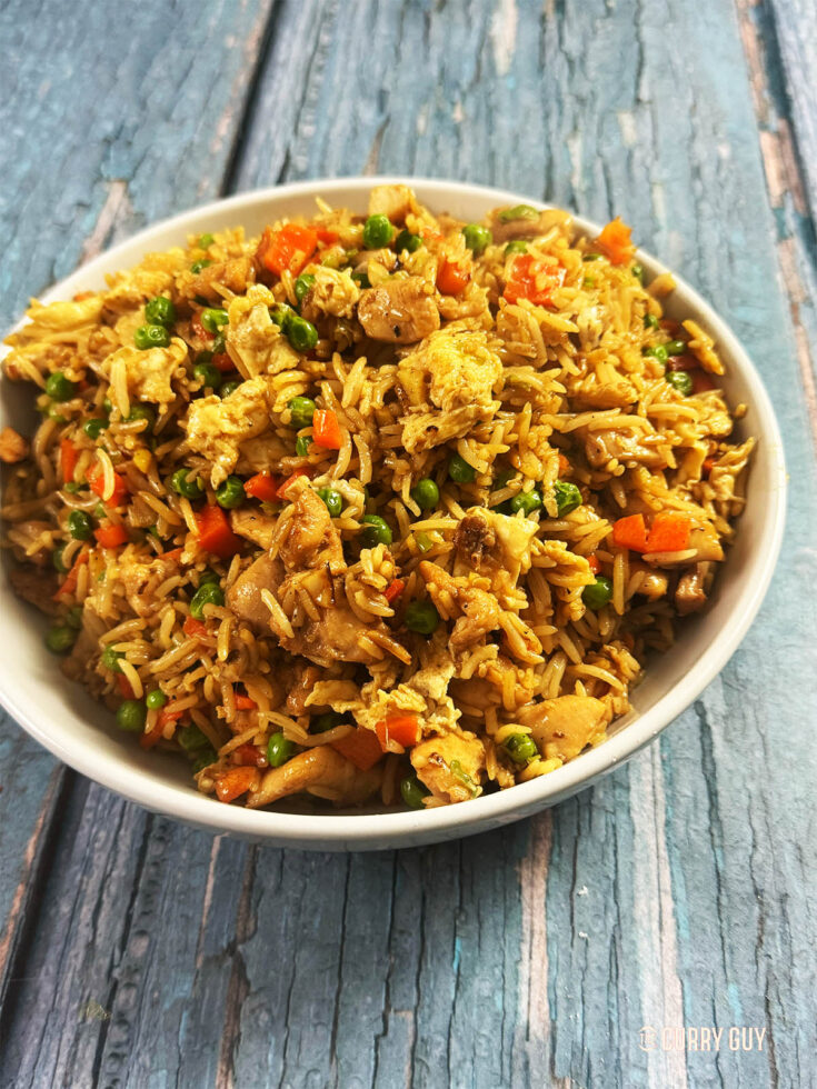 Chicken fried rice in a serving bowl.