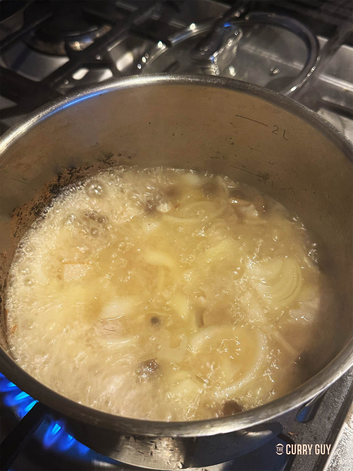 Adding water, lard, sake and mirin to the pan to simmer before blending. 