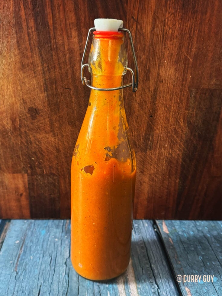 A bottle of mango habanero sauce.