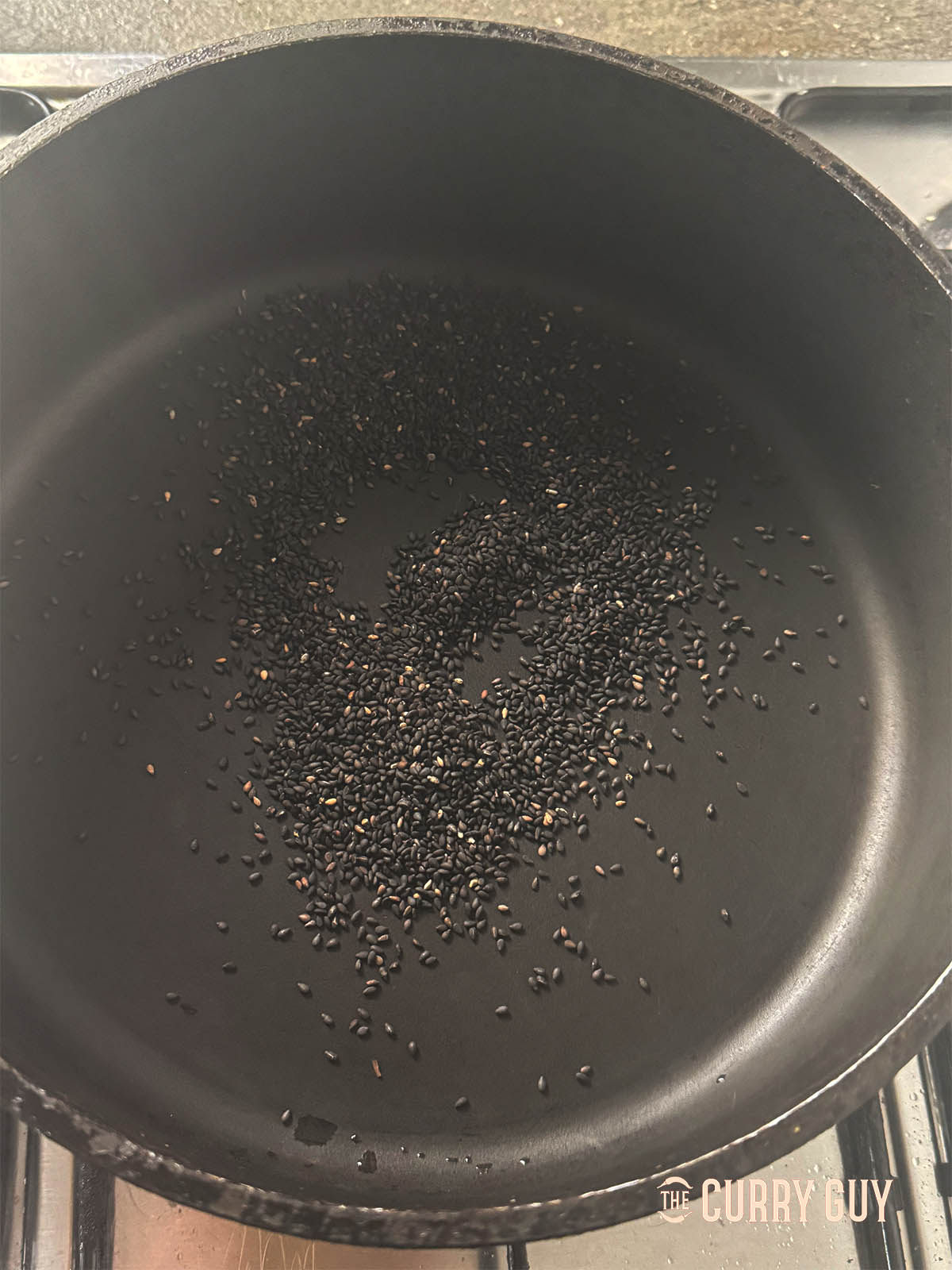 Roasting the black sesame seeds over a low heat.