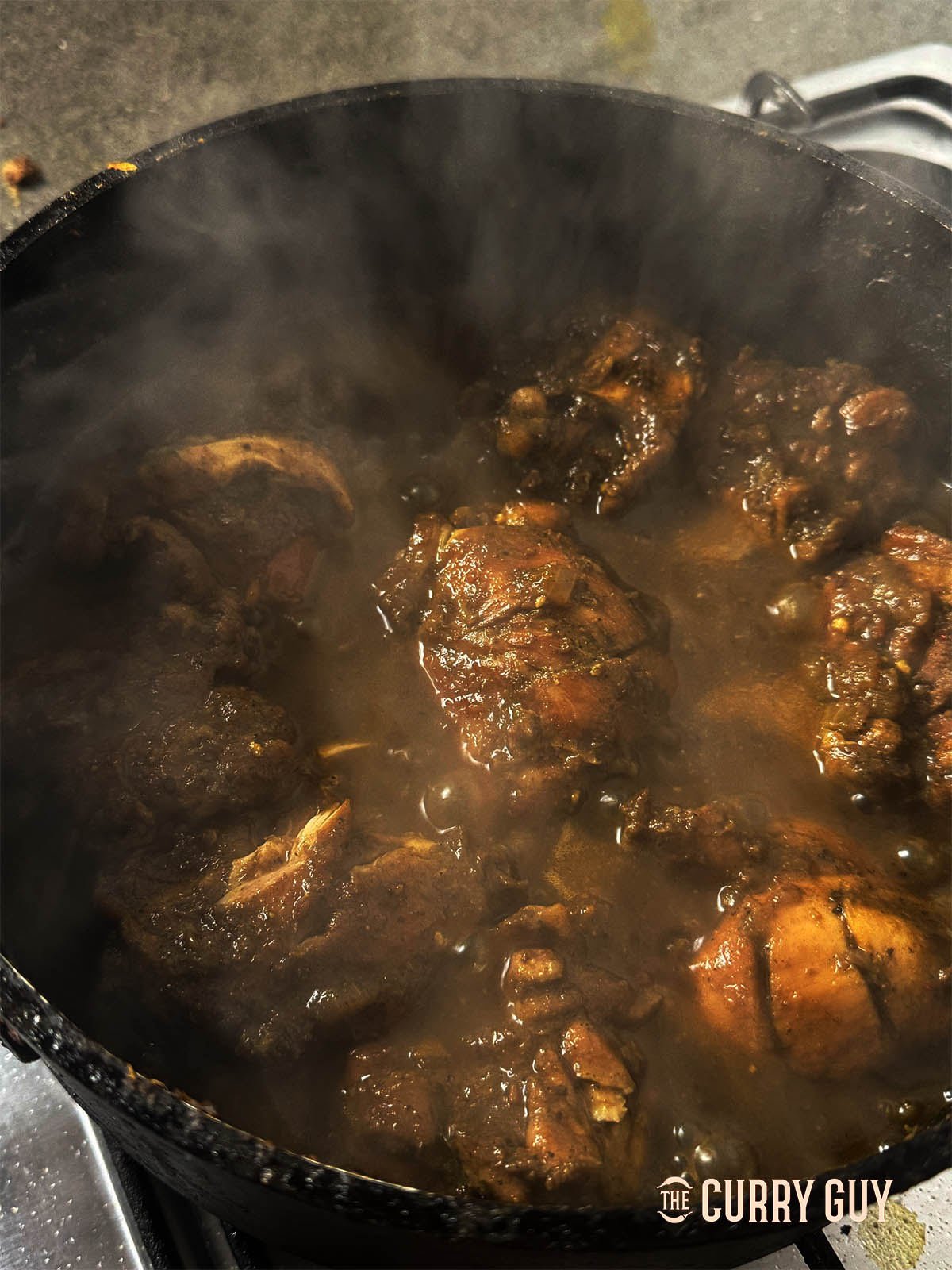 Simmering the curry to thicken the sauce and seasoning with salt to taste t