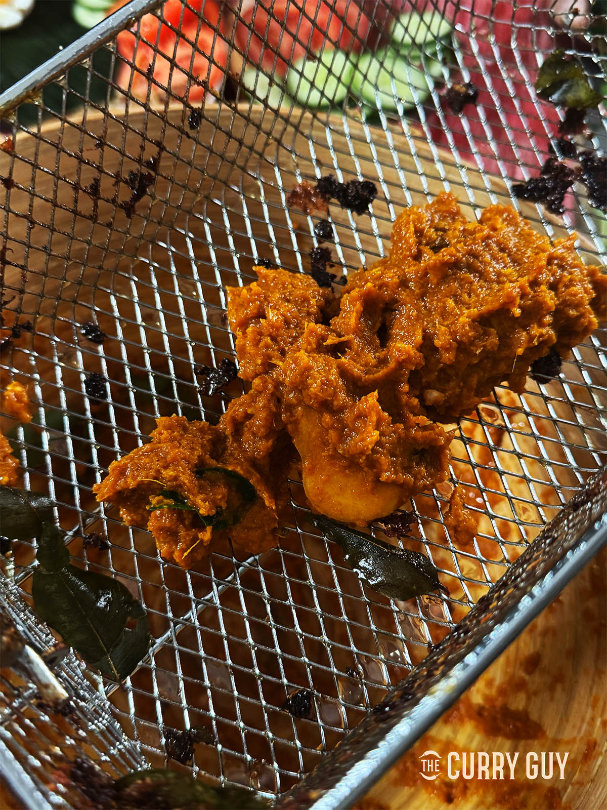 The marinade going into the oil to fry.