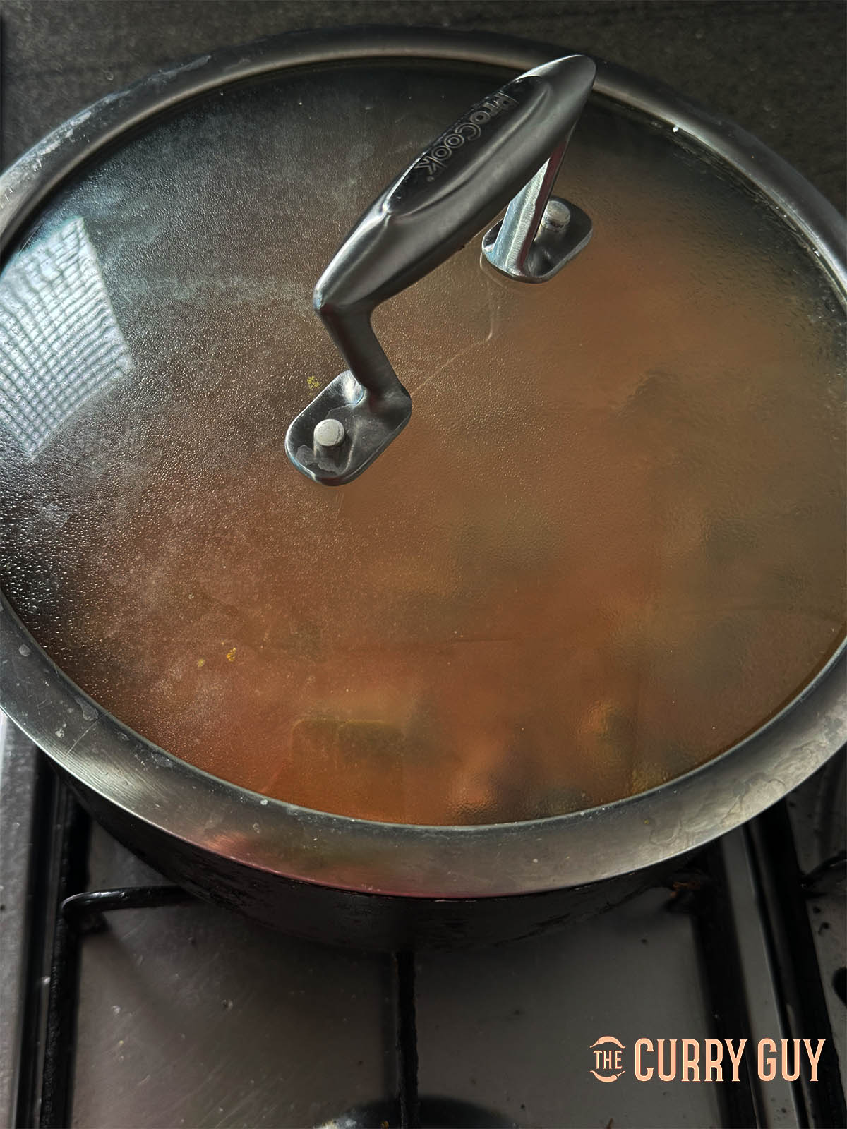 Adding water to cover and then cooking, covered for about 40 minutes until the lamb is tender.