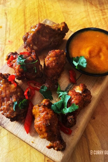 Serving the habanero chicken wings with habanero sauce.