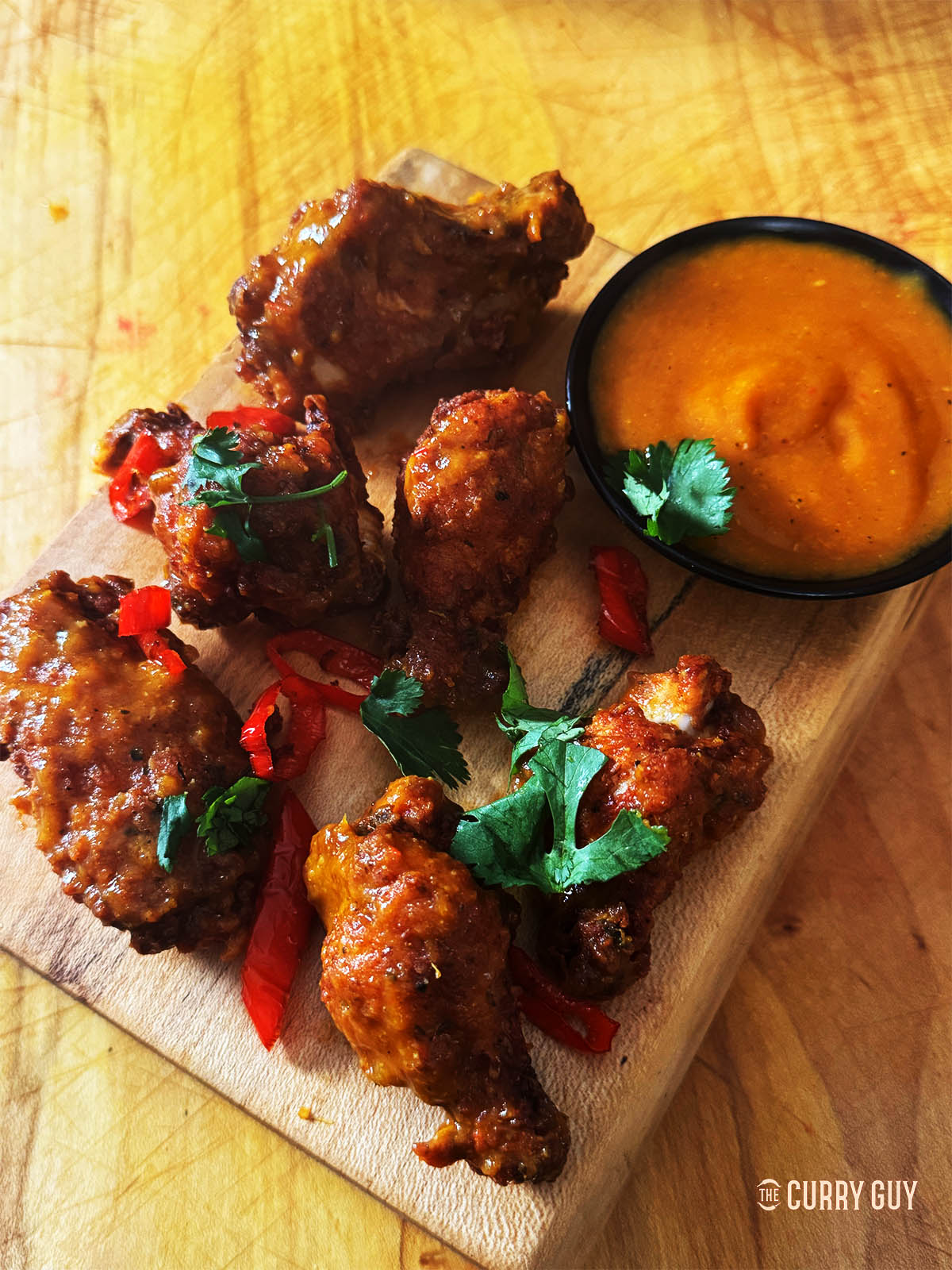 Serving the habanero chicken wings with habanero sauce.