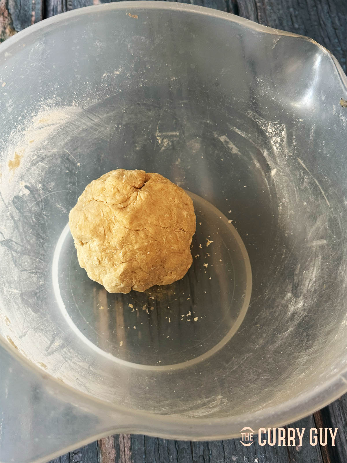 A formed dough ball for the puris.