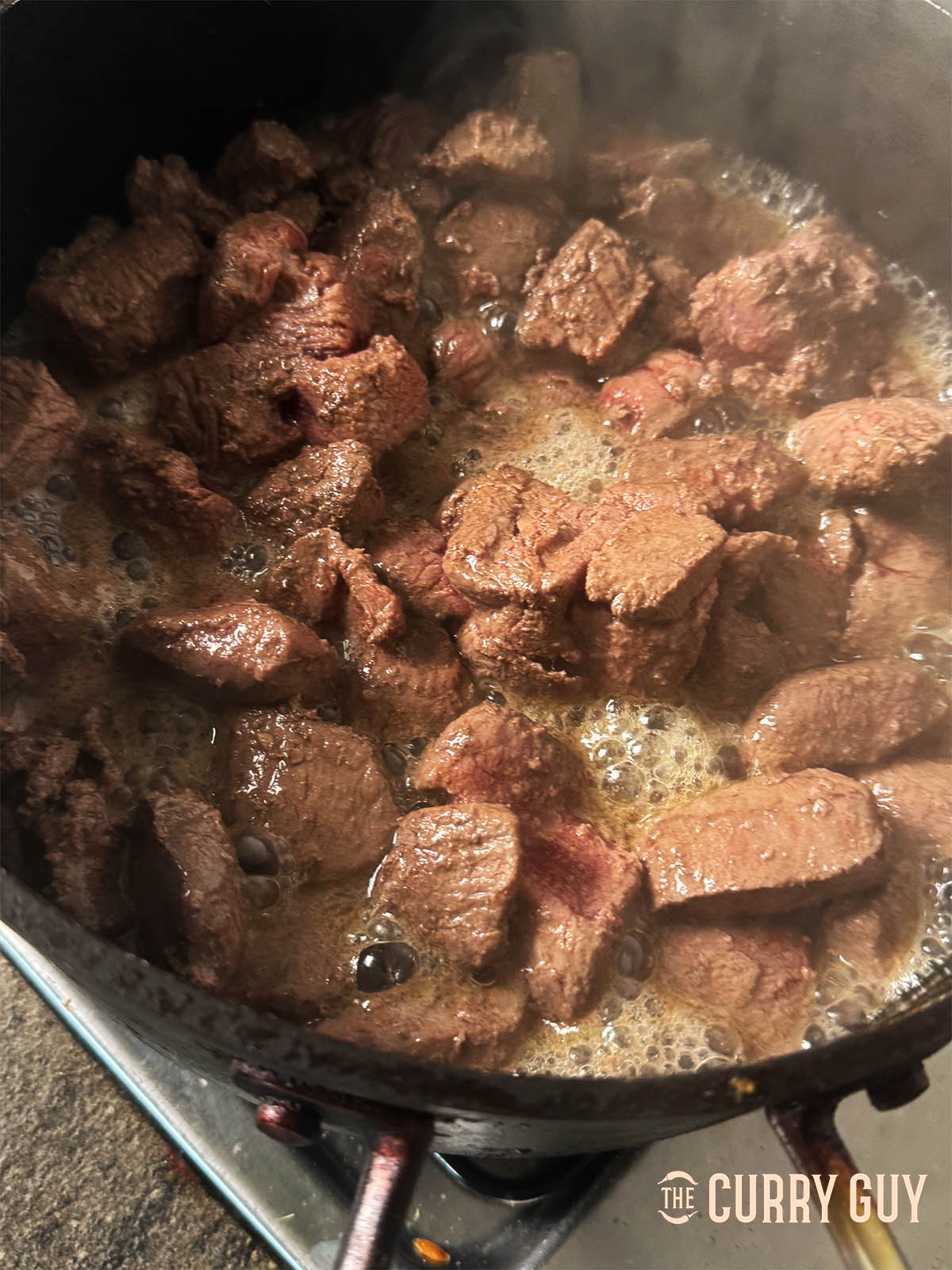 Browning the meat in oil.