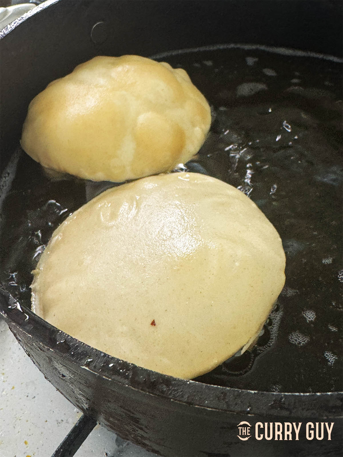 Frying the puris for the prawn puri.