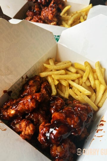 Boneless Chicken Wings covered in BBQ Sauce.