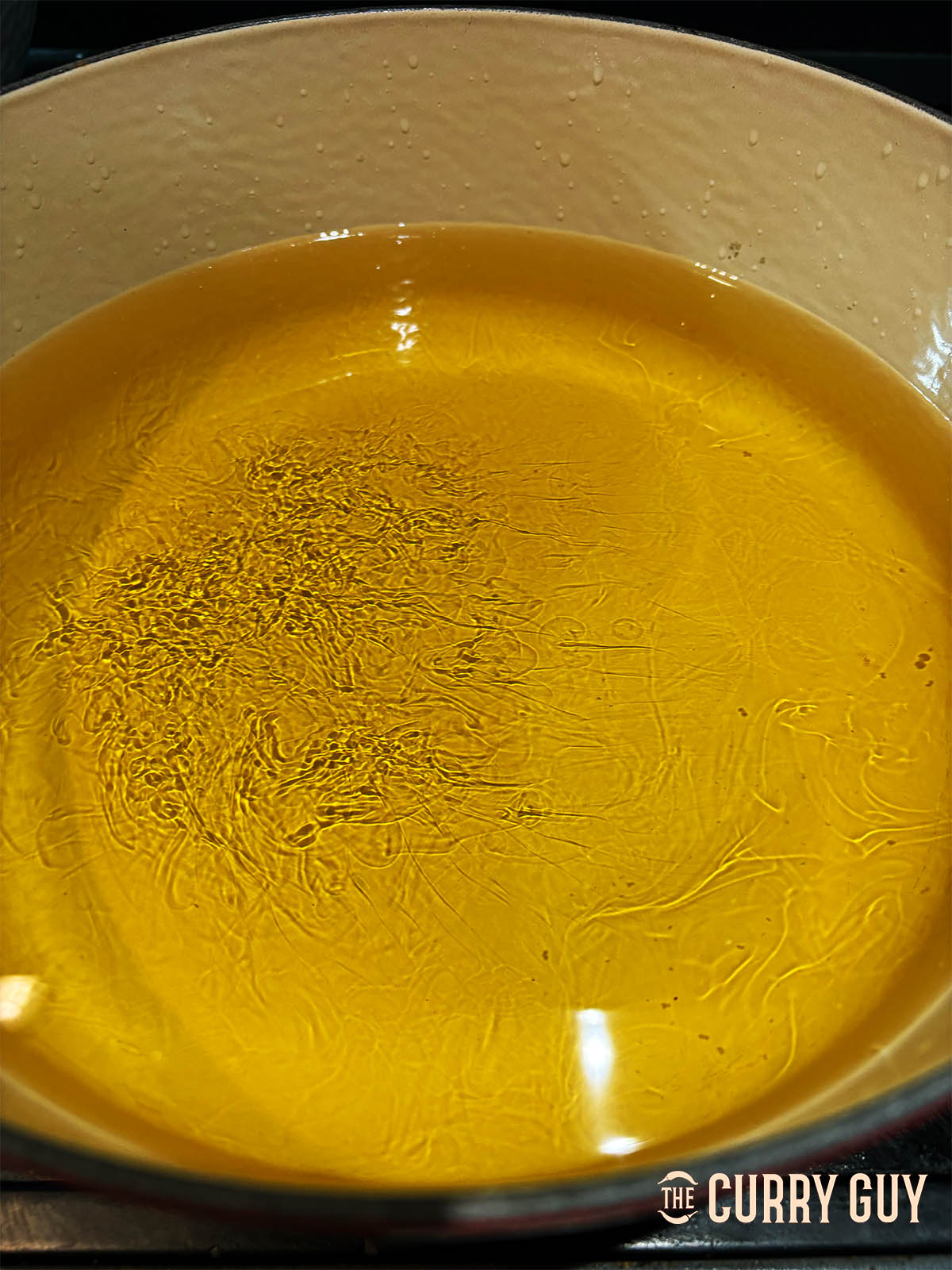 Heating the oil for frying the chicken.
