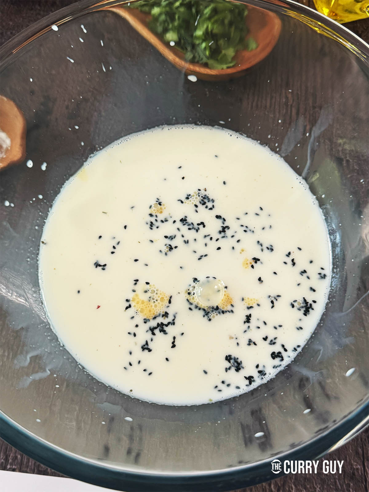 The liquid for the dough in a bowl.