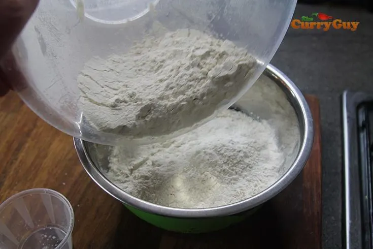 Pouring the flour into the liquid