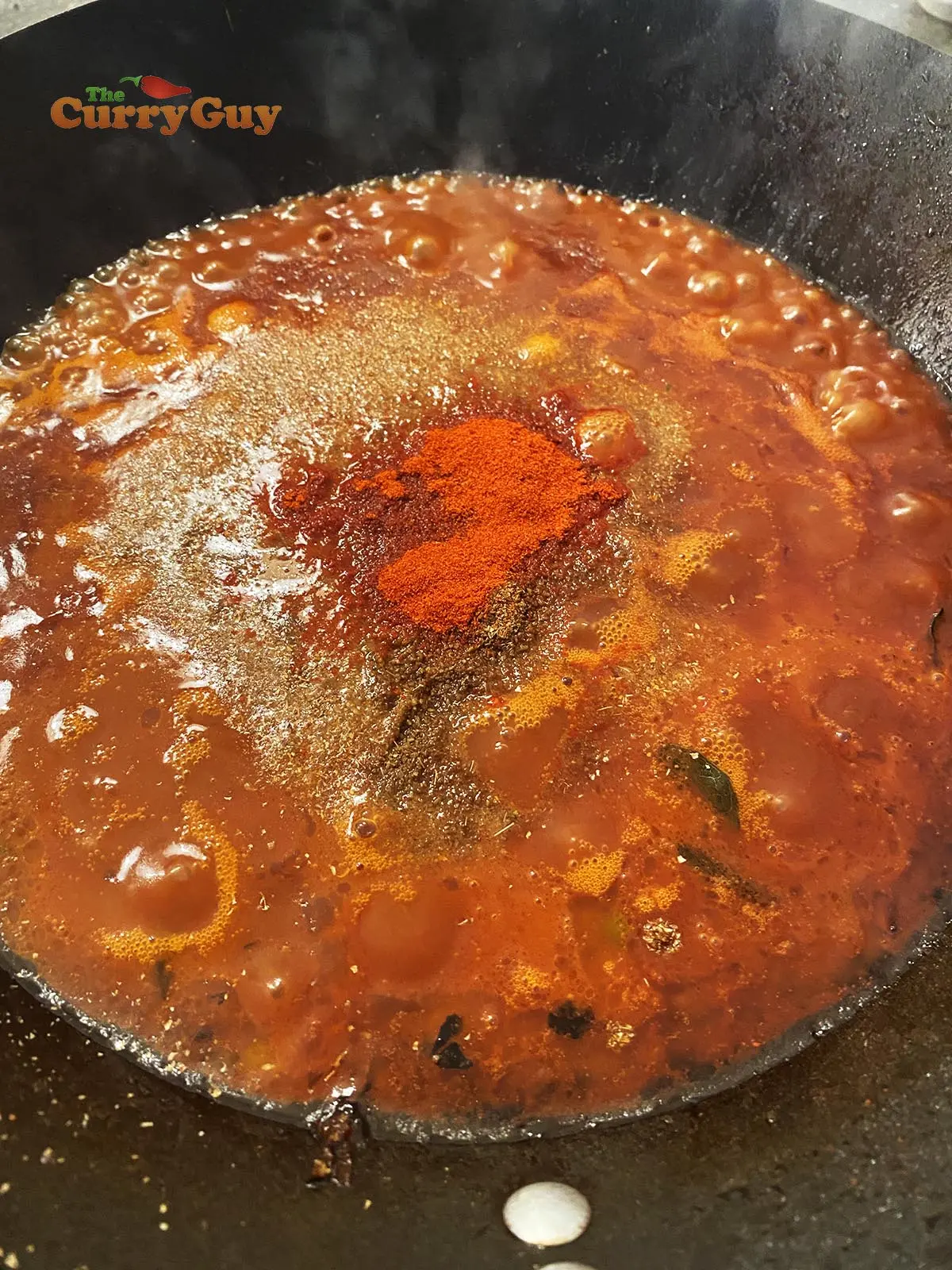 BBQ Sauce simmering in a pot.