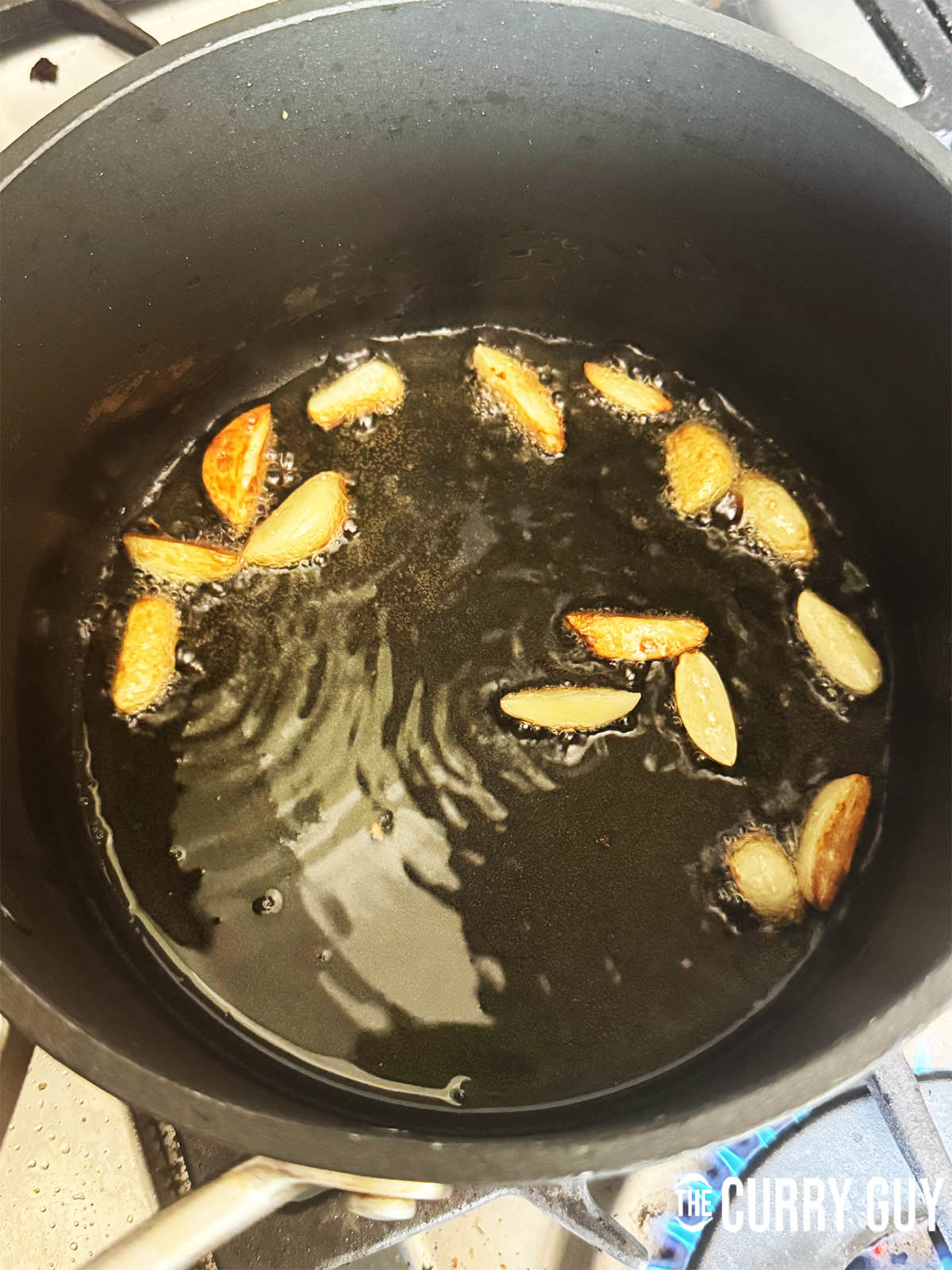 Frying the garlic in ghee.