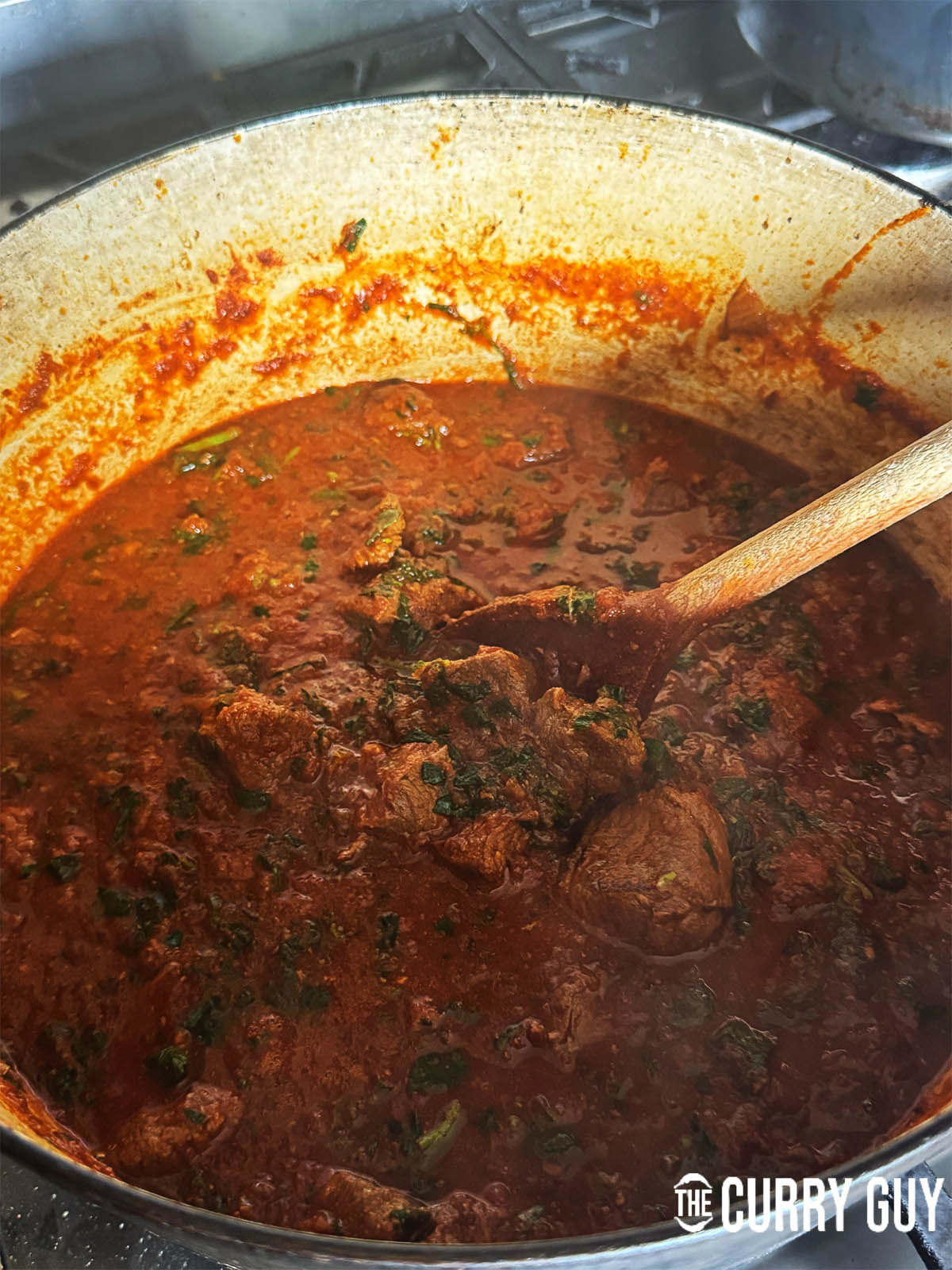 Finishing the curry off by simmering to thicken the sauce and adding lemon juice, garam masala and salt to taste.