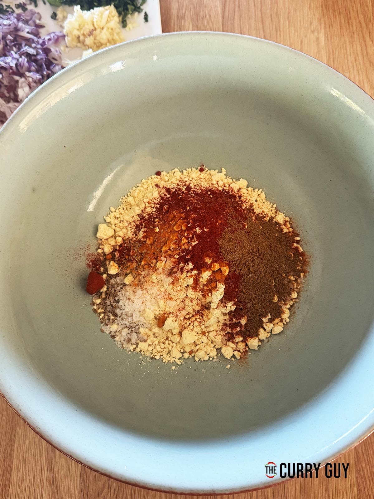 The flour and spices in a mixing bowl.