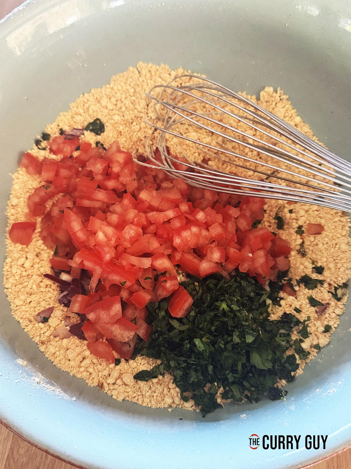 Adding the fresh ingredients to the flour mixture.