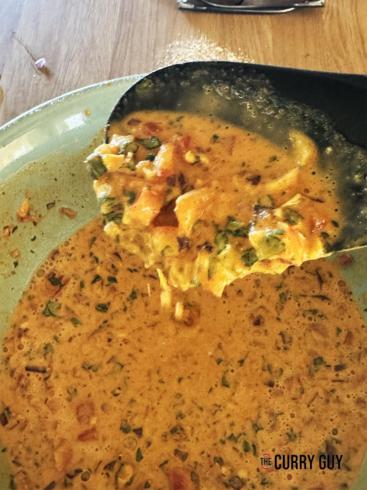 The batter on a spoon. It is pourable consistency.