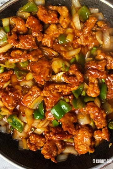 Stirring in the chilli chicken