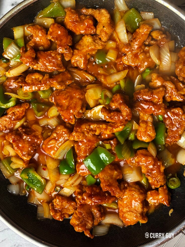 Stirring in the chilli chicken