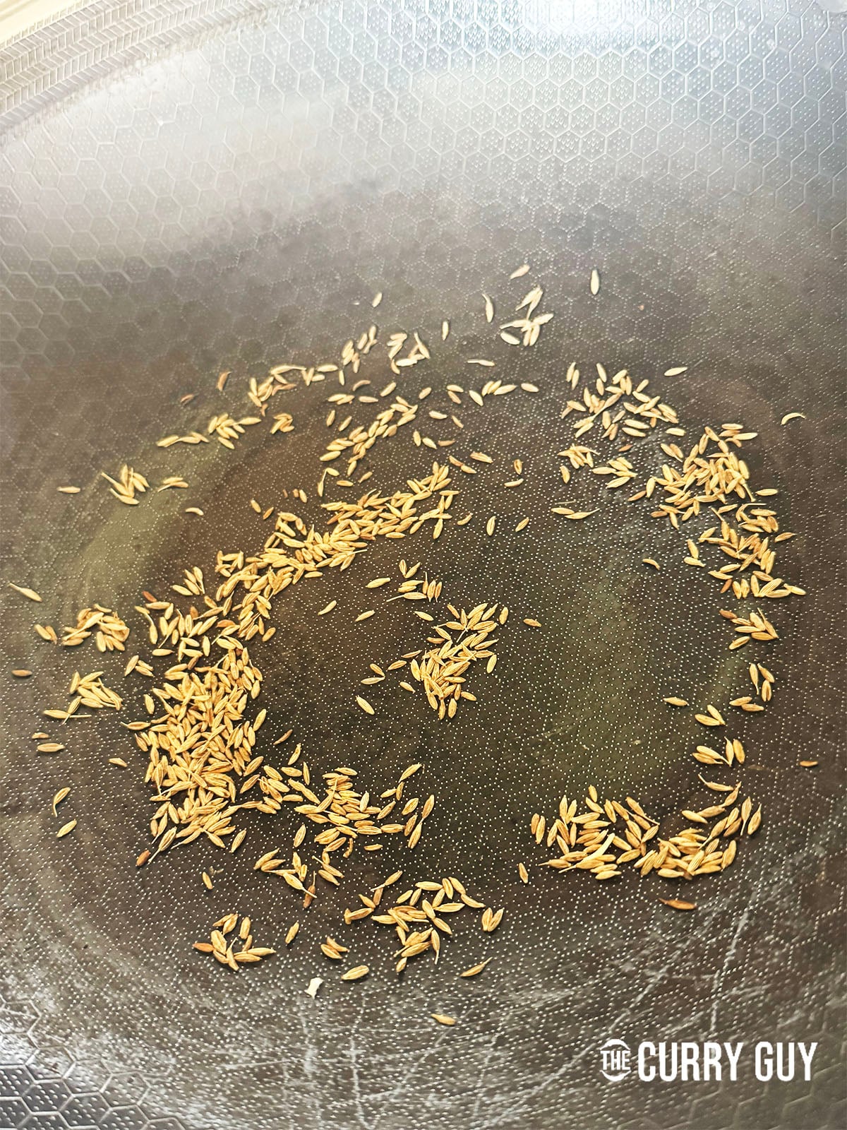 toasting cumin seeds