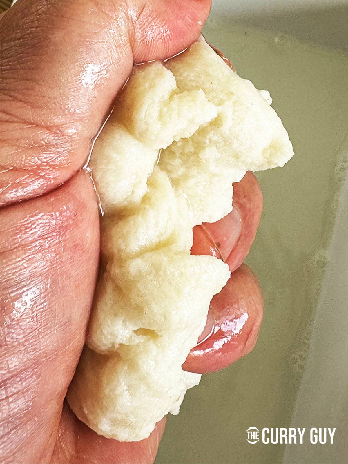 squeezing out the moisture in the bread